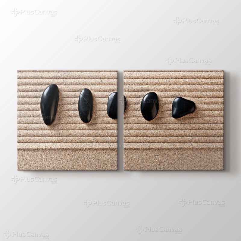 Kum üstünde Çakıl Taşları görseli.